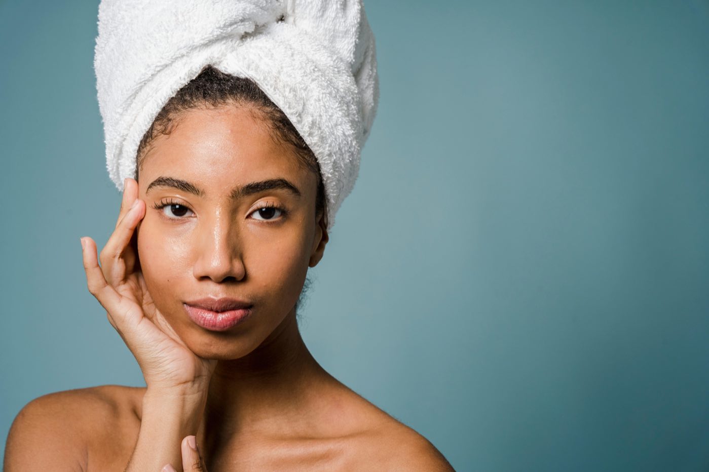Beauty professional with glowing, freshly treated skin